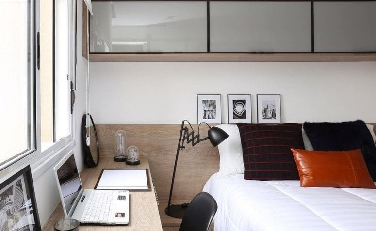 Foto de um quarto de casal com escritório para ilustrar um texto sobre aproveitar o espaço no blog da Soma Urbanismo. 